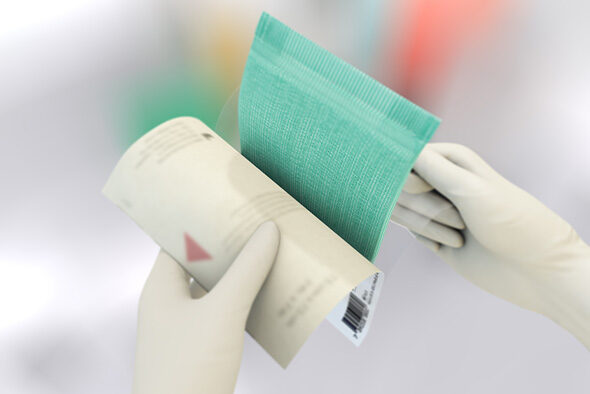 Person opening the inner packaging of a Sorbact Absorption dressing.