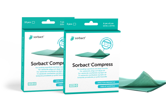 Sorbact Compress packages with a dressing beside them.