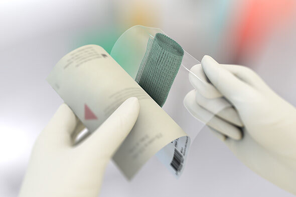 Person opening the inner packaging of a Sorbact Fungi dressing.