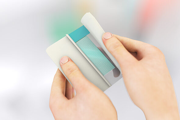 Person opening the inner packaging of a Sorbact Secure dressing.